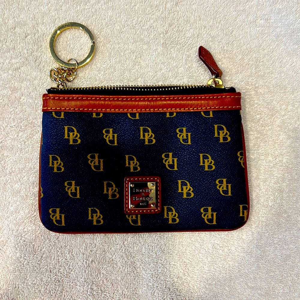 Dooney and Bourke navy zipper change purse with key fob. Never used